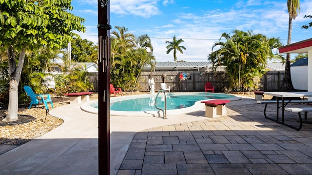 view of pool featuring a patio area