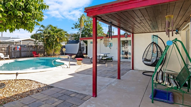 view of swimming pool with a patio area