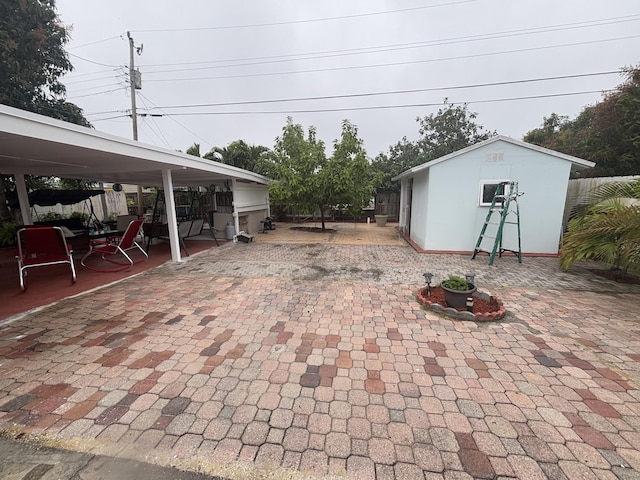 view of patio with an outbuilding