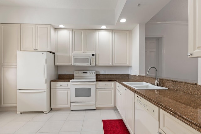 kitchen featuring white cabinetry, white appliances, and sink