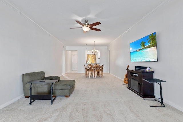 living area with crown molding, ceiling fan with notable chandelier, and light carpet