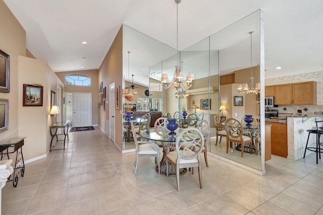 tiled dining room featuring a chandelier