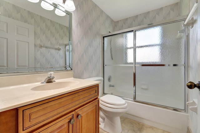 full bathroom with vanity, tile patterned flooring, enclosed tub / shower combo, and toilet