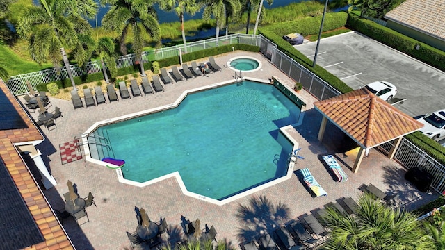 view of pool with a gazebo, a patio area, and a hot tub