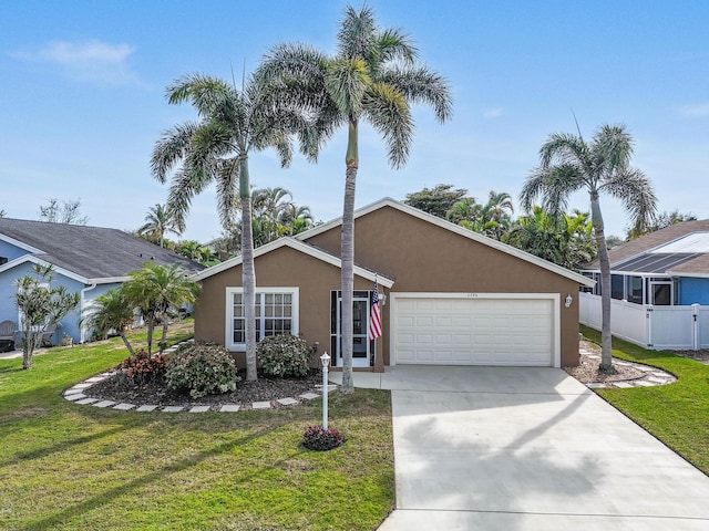 single story home featuring a garage and a front yard