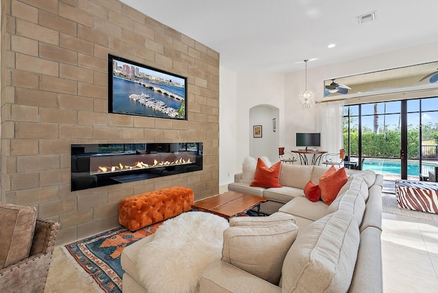 tiled living room with a fireplace