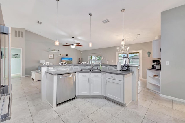 kitchen featuring stainless steel dishwasher, pendant lighting, vaulted ceiling, white cabinetry, and light tile patterned floors