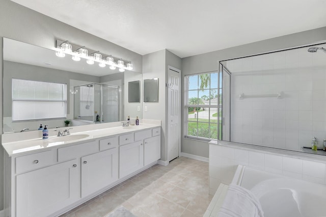 bathroom with vanity, tile patterned floors, and shower with separate bathtub