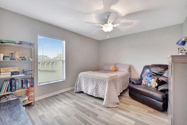 bedroom featuring light wood-type flooring and ceiling fan