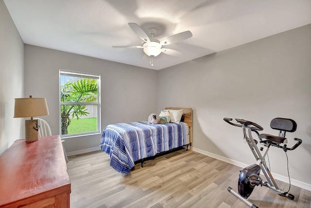 bedroom with light wood-type flooring and ceiling fan