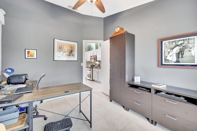 tiled office space with ceiling fan