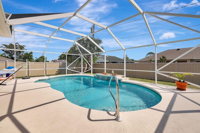 view of pool featuring pool water feature, a lanai, and a patio