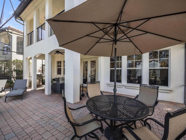 view of patio / terrace with french doors, ceiling fan, and an outdoor hangout area