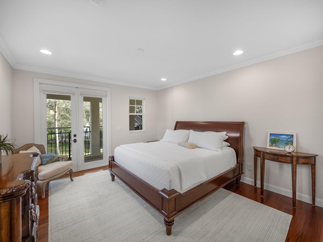 bedroom with hardwood / wood-style flooring, ornamental molding, access to exterior, and french doors