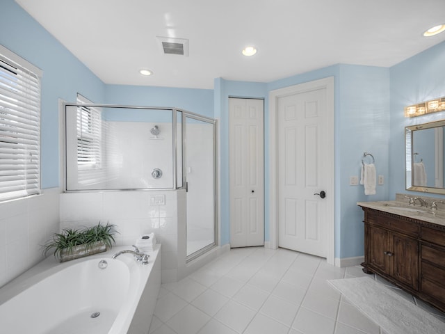 bathroom featuring vanity, separate shower and tub, and tile patterned floors