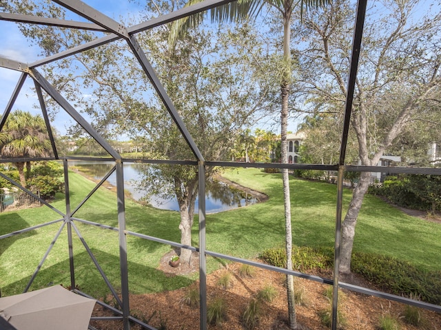 unfurnished sunroom featuring a water view