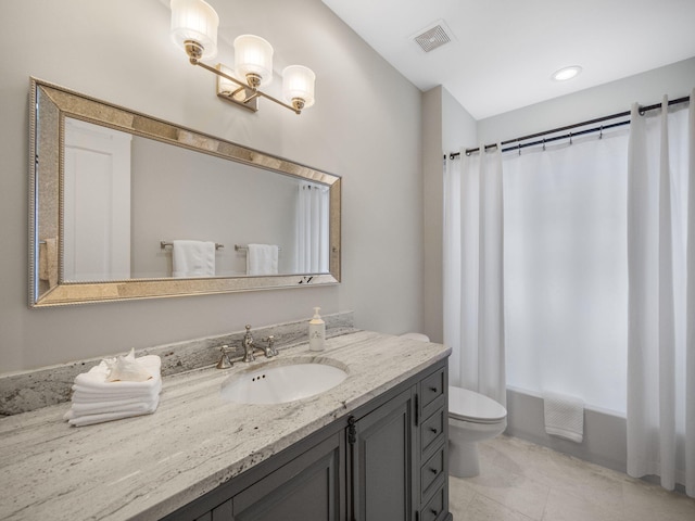 full bathroom with vanity, tile patterned flooring, toilet, and shower / bath combo with shower curtain