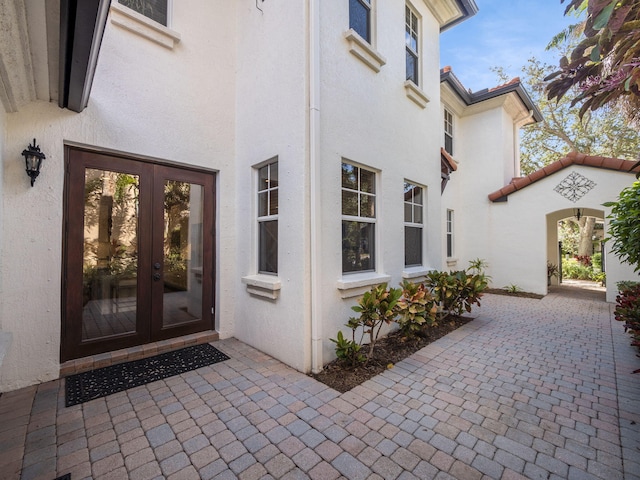 doorway to property featuring a patio and french doors