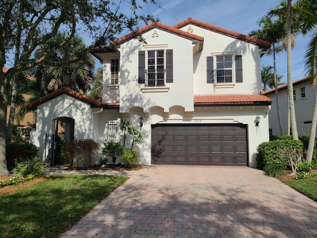 mediterranean / spanish-style house featuring a garage