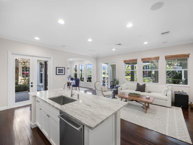 kitchen with french doors, sink, light stone counters, dishwasher, and white cabinets