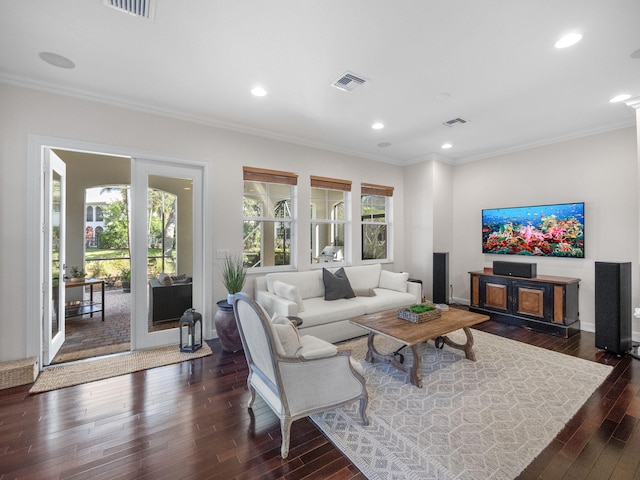 living room featuring ornamental molding and dark hardwood / wood-style flooring