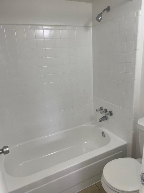 4261 W Mcnab Rd Unit 13, Pompano Beach, FL 33069 - bathroom with toilet, tile patterned floors, and  shower combination