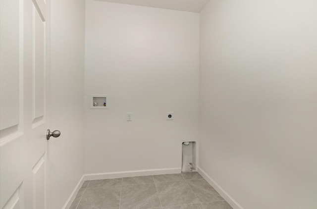 laundry area featuring washer hookup, baseboards, laundry area, hookup for an electric dryer, and light tile patterned floors