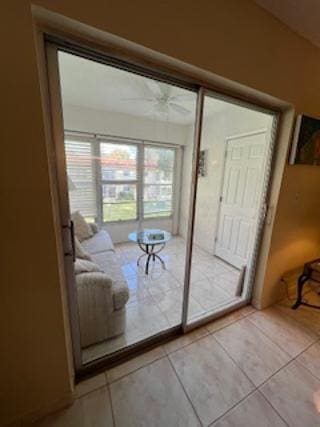 doorway with light tile patterned floors