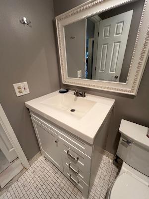 bathroom with tile patterned floors, toilet, and vanity