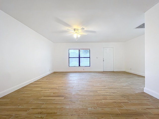 empty room featuring light wood-type flooring and ceiling fan