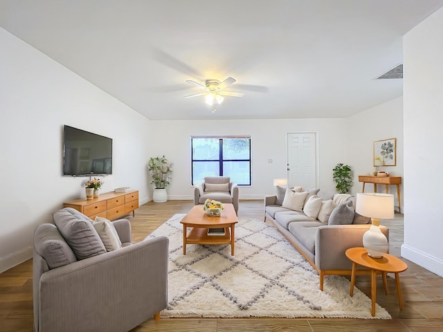 living room featuring ceiling fan and wood-type flooring