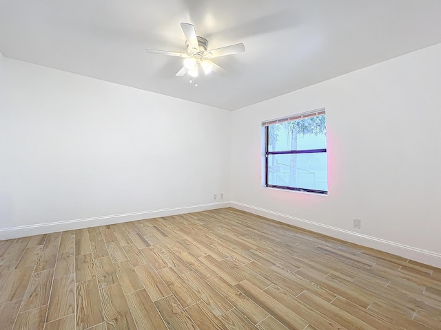 unfurnished room with ceiling fan and light wood-type flooring