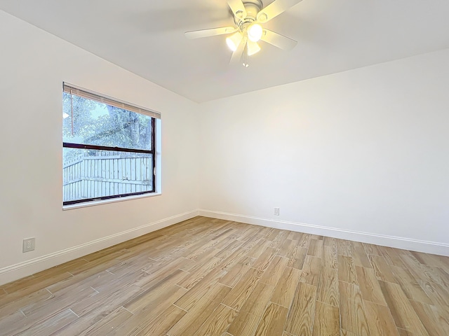 spare room with ceiling fan and light hardwood / wood-style flooring