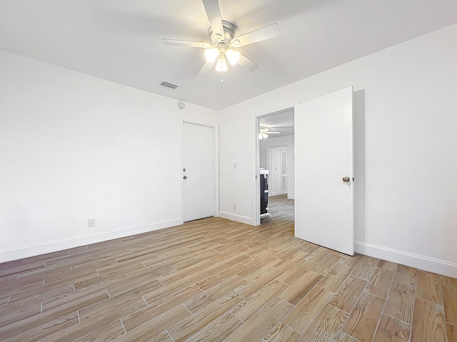 spare room with ceiling fan