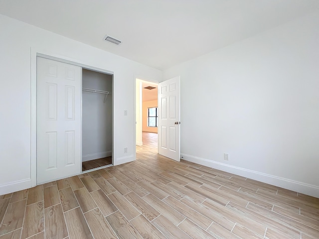 unfurnished bedroom featuring a closet