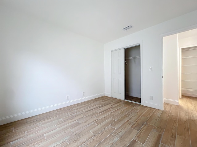 unfurnished bedroom with a closet