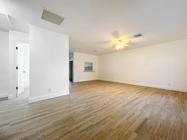 unfurnished living room featuring ceiling fan and light hardwood / wood-style flooring