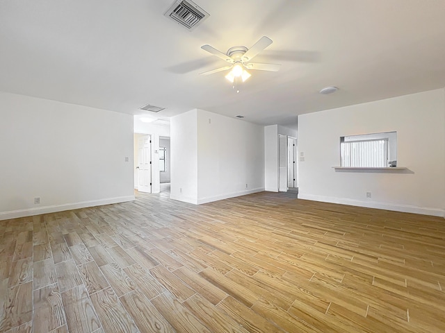 unfurnished living room featuring ceiling fan and light hardwood / wood-style flooring