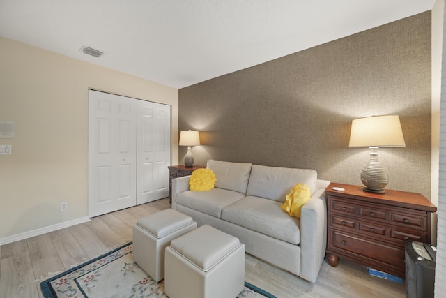 living room with light hardwood / wood-style floors