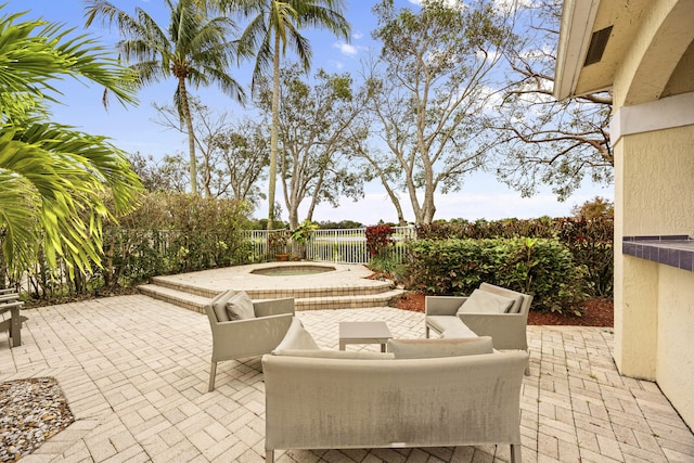 view of patio with an in ground hot tub and outdoor lounge area