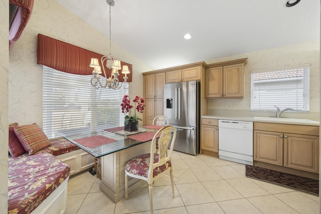 kitchen with white dishwasher, stainless steel fridge with ice dispenser, sink, pendant lighting, and vaulted ceiling