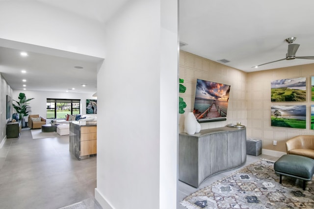 interior space featuring ceiling fan