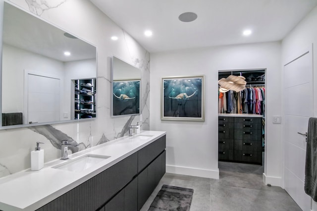 bathroom featuring concrete floors and vanity