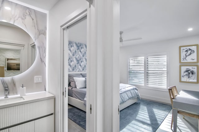 bedroom with sink and ceiling fan