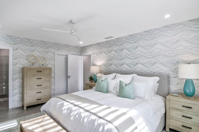 bedroom featuring ceiling fan and concrete floors