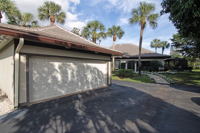 view of side of property with a garage