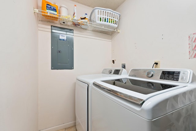 5280 SE Dell St, Stuart, FL 34997 - washroom featuring electric panel and separate washer and dryer
