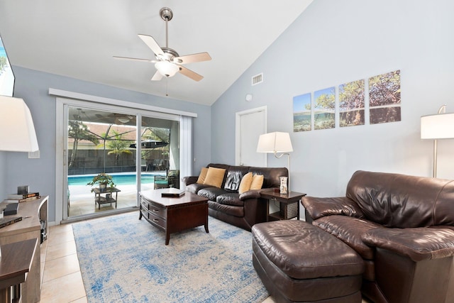 living room featuring high vaulted ceiling, light tile patterned floors, and ceiling fan