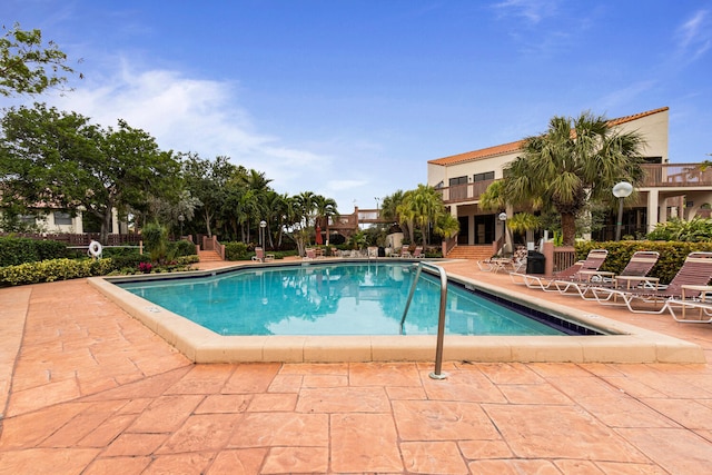 view of swimming pool with a patio area