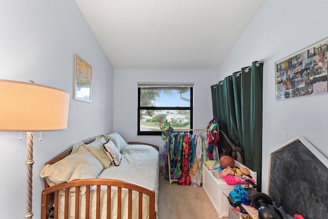 carpeted bedroom featuring vaulted ceiling